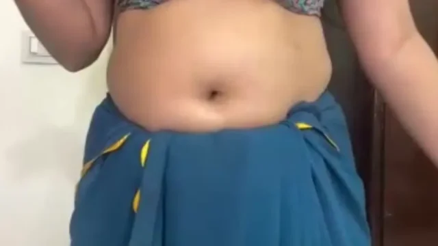This horny Indian bhabhi forgot to wear her bra properly while live cam dancing, showing one big boob